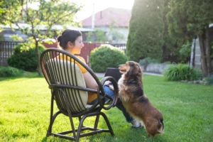woman and dog enjoying a flea-free yard